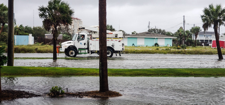 a power truck fixing electricity issues after a hurricane